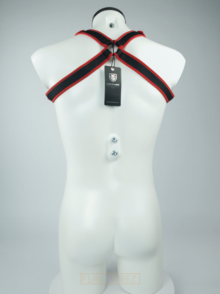 Zwart neopreen harnas met rode reflecterende banden, de perfecte accessoire voor stoute feesten, fetish feesten, gay prides, gay cruises, cruise bars, gay clubs etc. ontworpen door TOF Paris en te koop bij Flavourez.