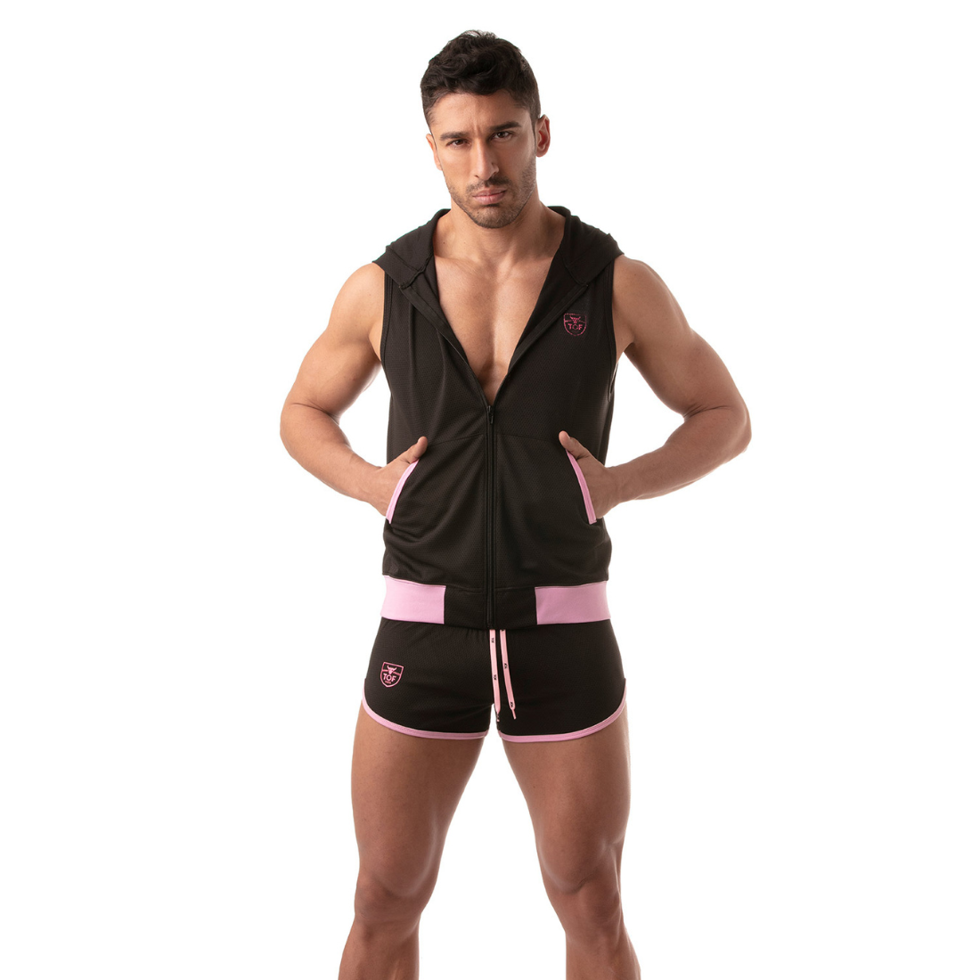 Zwarte hoodie zonder mouwen met roze accenten, ontworpen door het Franse modehuis Tof Paris. Perfect voor gay mannen en te koop bij Flavourez.