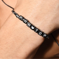 Zwarte gay armband voor de echte power top! Ontworpen door het bekende Amerikaanse gay merk Andrew Christian. Te koop bij Flavourez.