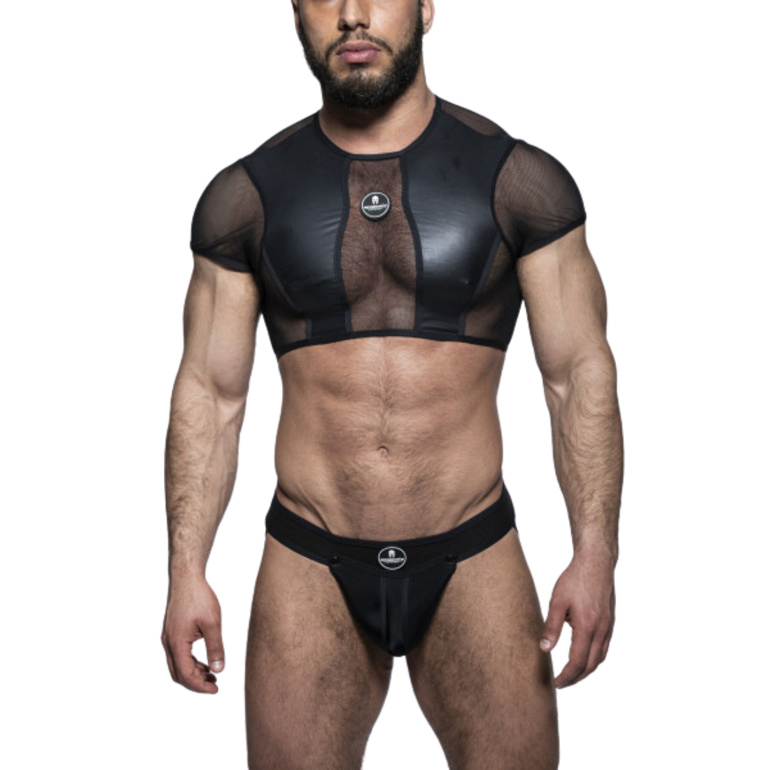 Zwarte crop top met zwarte meshstof, gemaakt door het fabuleuze Italiaanse merk Sparta’s Harness. Perfect voor gay mannen en te koop bij Flavourez.