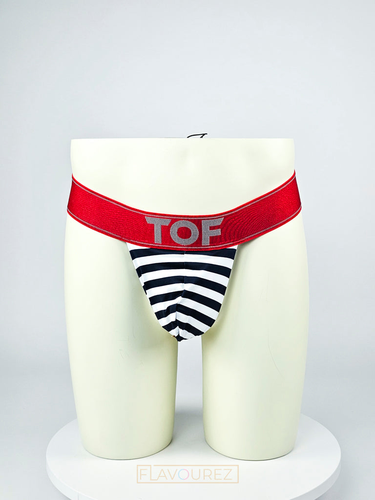 Draadloze heren zwemstring met rode tailleband en witte en blauw strepen. Ontworpen door het Franse modehuis Tof Paris en te koop bij Flavourez.