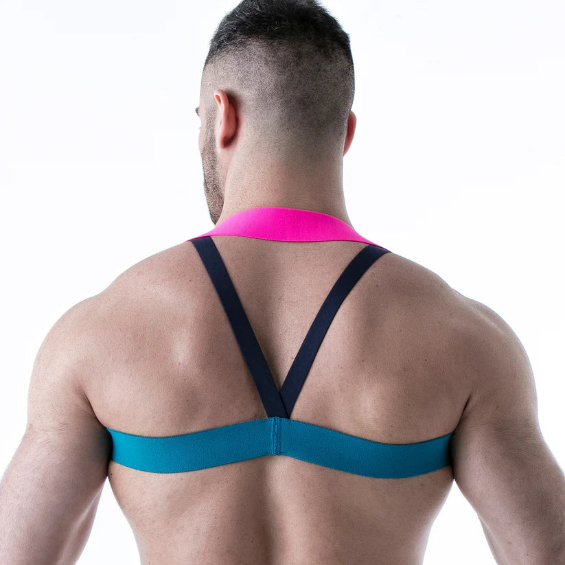 Neonblauw met neonroze harnas. Ontworpen door Leader. Perfecte outfit voor een gay club of cruise bar. Verkrijgbaar bij Flavourez