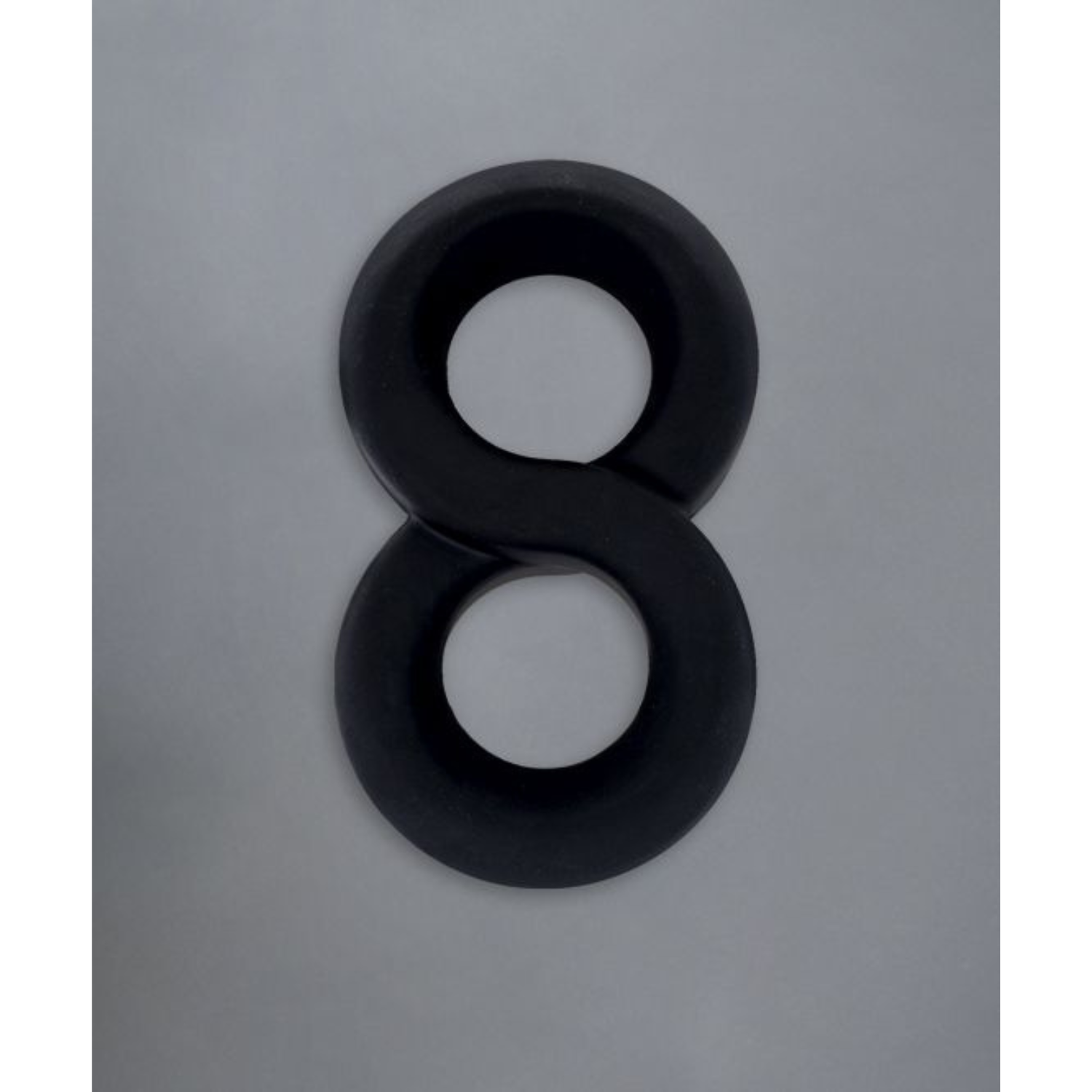 Zwarte infinity-design cock ring van Andrew Christian. Perfect voor gay mannen en te koop bij Flavourez.